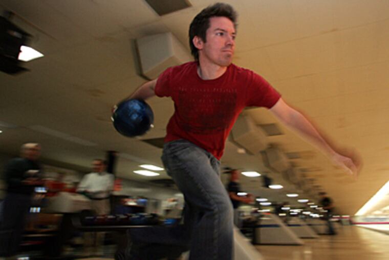 Kevin Vierling Jr., 29, takes aim. He bowls with his father and a brother; four sets of father-and-son bowlers roll in NAF.