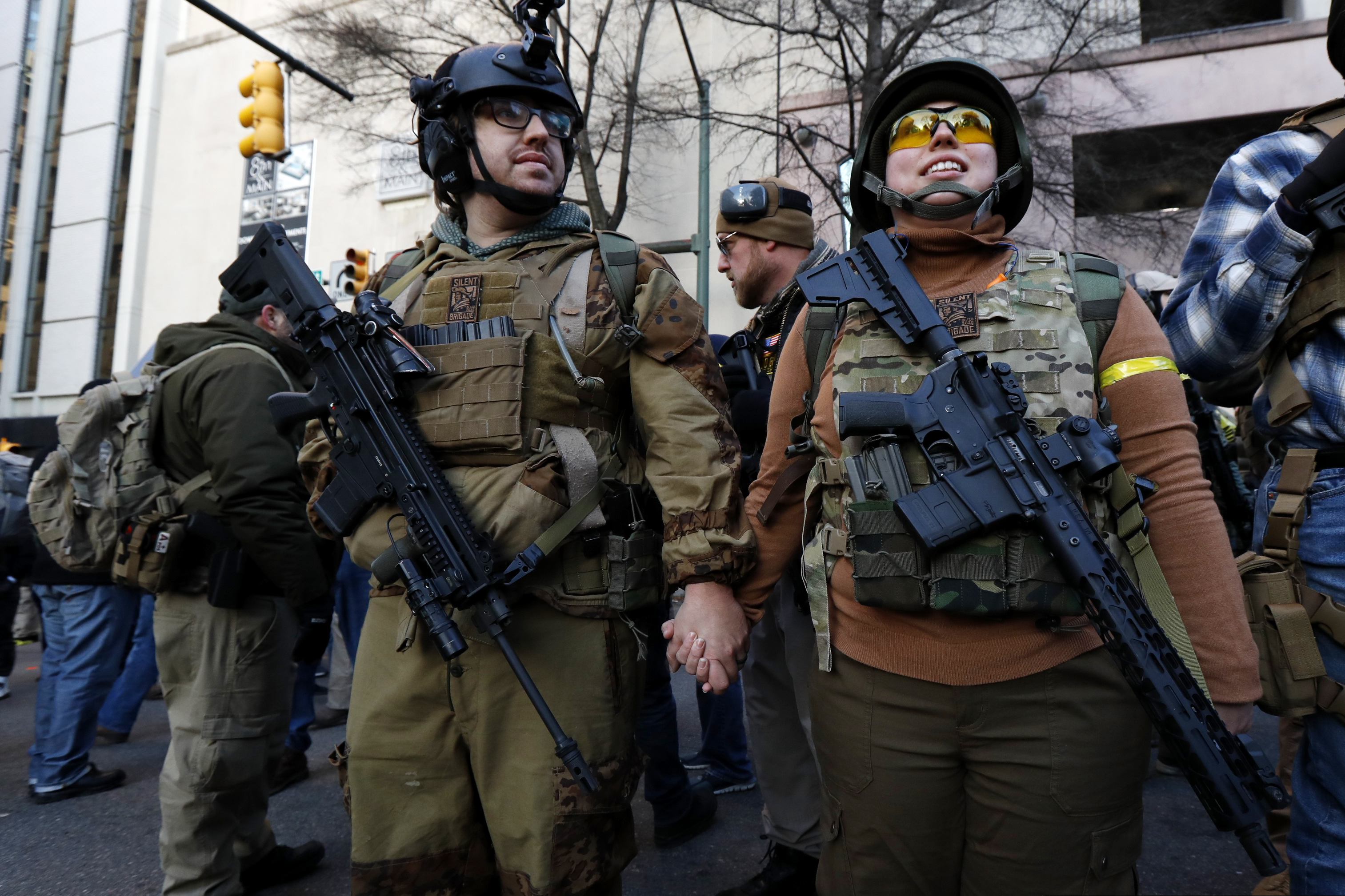 Demonstrators stand outside a security zone before a pro-gun rally in January in Richmond, Va. Gov. Ralph Northam signed a gun-control bill on Friday.