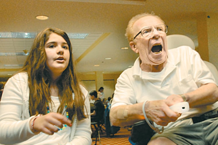 Nintendo Wii bowling unites Natalie Niessner, 11, and Jack Kaplan, 75, in Washington Township. "Let's hearit for the elderly!" Kaplan exclaimed after a spare.