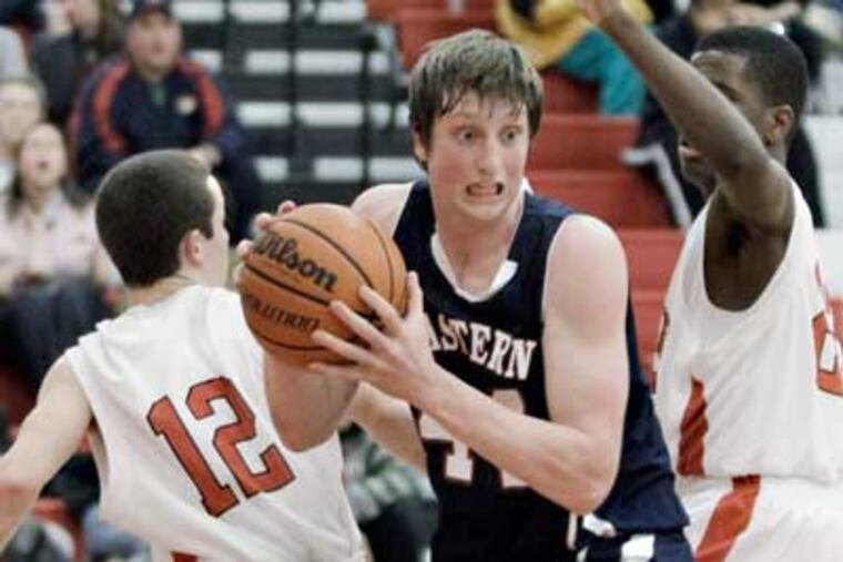 Eastern's Matt Klinewski gets to a rebound before Lenape's Sawyer Hand during the boys basketball game (Elizabeth Robertson/Staff Photographer)