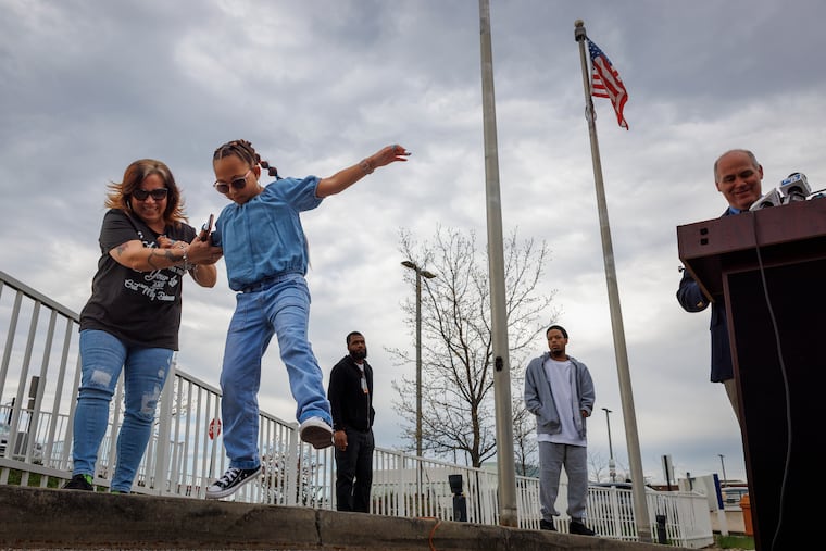 Maria Ugarte with her 9-year-old daughter, Arianna, after the little girl helped raise the "Gift of Life" flag in recognition of national Donate Life Month on April 1 at St. Christopher's Hospital for Children in North Philadelphia.