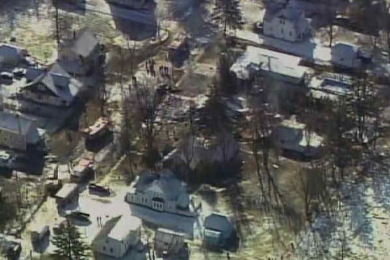 A television image offers an aerial view of the crash site of Continental Connection Flight 3407 in Clarence Center, N.Y. The Newark-to-Buffalo flight did not nose-dive into the house, as some witnesses had reported, an investigator said.