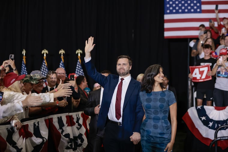 Republican vice presidential nominee Sen. JD Vance waves to supporters as he and his wife Usha Vance arrive to a rally at the Newtown Athletic Club on Saturday, Sept. 28, 2024.