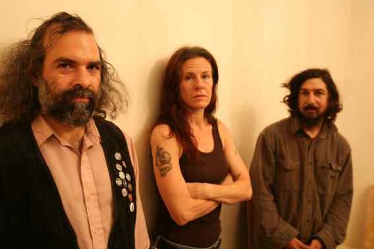 Stinking Lizaveta: Yanni Papadopoulos (left), guitar; Cheshire Agusta, drums, and Alexi Papadopoulos, elec- tric upright bass. Their new album is "Sacrifice & Bliss."