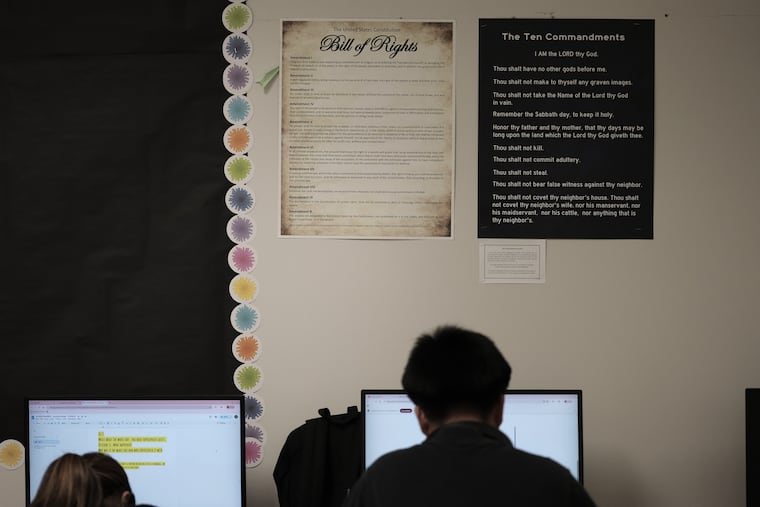 FILE - Students work under Ten Commandments and Bill of Rights posters on display in a classroom at Lehman High School in Kyle, Texas, Thursday, Oct. 16, 2025. (AP Photo/Eric Gay,File)