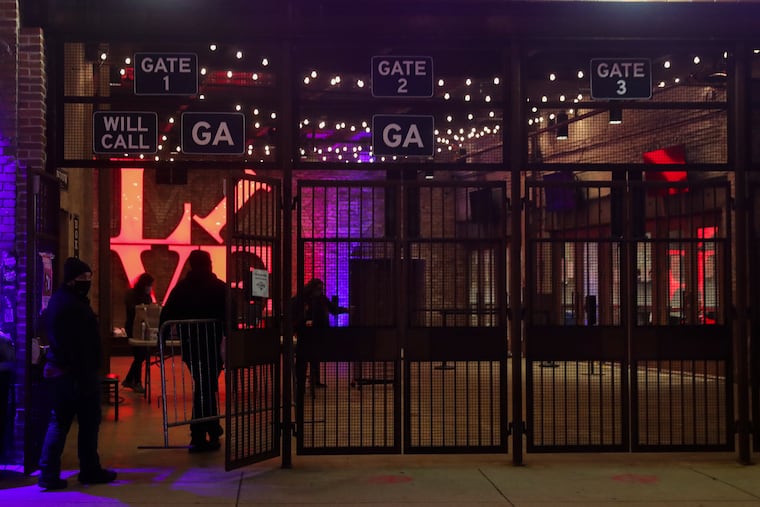 Crews clean up and break down ballot machines at the Fillmore music venue after the polls close in Philadelphia on Election Day.