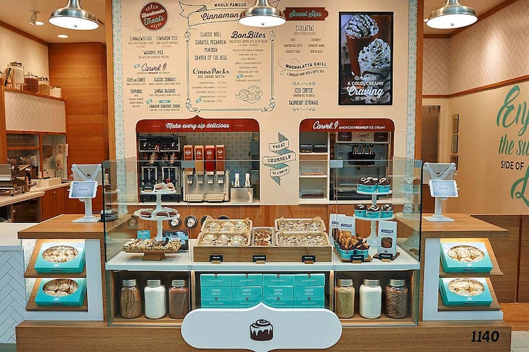 The new Cinnabon bakery design is inspired by pastry shops in France, with an open kitchen. Baking is done out front, in view of the customers.