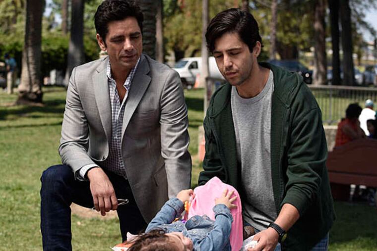 John Stamos (left) and Josh Peck play a father and son getting to know each other for the first time in Fox’s “Grandfathered.”