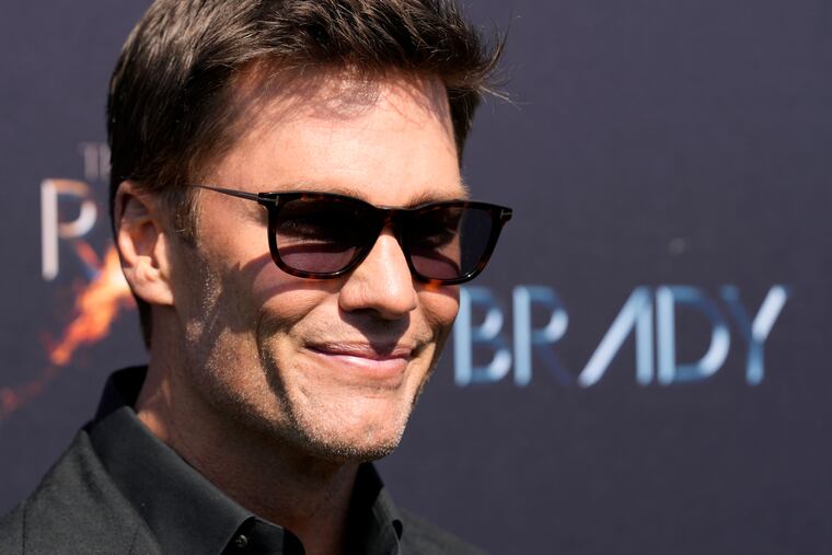 Tom Brady poses on the red carpet before "The Greatest Roast of All Time: Tom Brady" at the Kia Forum on Sunday.