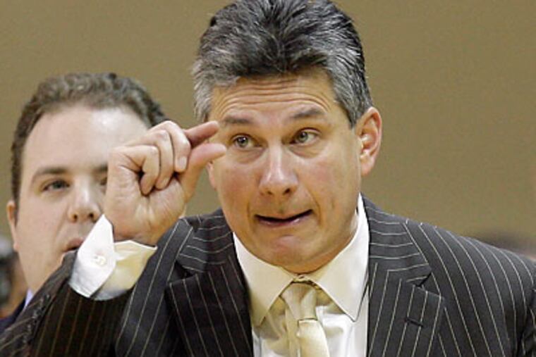 After years of coming close, La Salle coach John Giannini finally got to celebrate a big win. (Yong Kim/Staff Photographer)