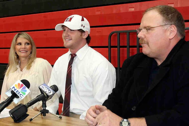 Eagles coach Andy Reid and his wife, Tammy, watched as son Spencer committed to Temple at Harriton High on Wednesday. Spencer Reid was a late addition to the Owls' recruiting class.