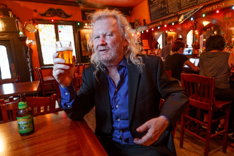 Fergus Carey, proprietor of Fergie's Pub, enjoys a half pint of his favorite, Sierra Nevada Pale Ale on Thursday.