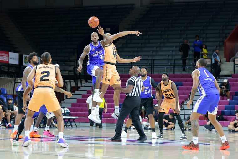 Chuck Ellis Workouts and Trusted Vision tip off during the first quarter of Sunday's JAB Classic tournament final.