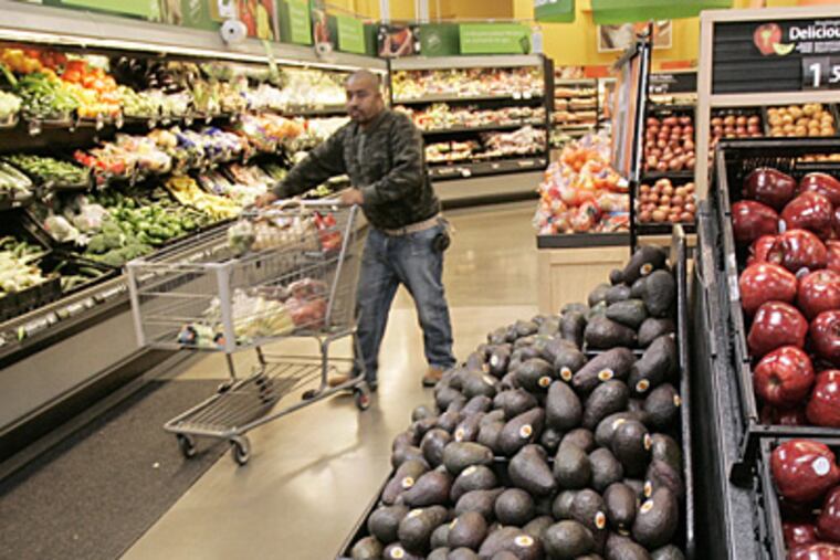 A supermarket produce aisle at a Maumelle, Ark., Wal-Mart Supercenter store. Yesterday, Wal-Mart Stores Inc. unveiled a Web site noting efforts to provide locally grown produce at its stores across the nation.