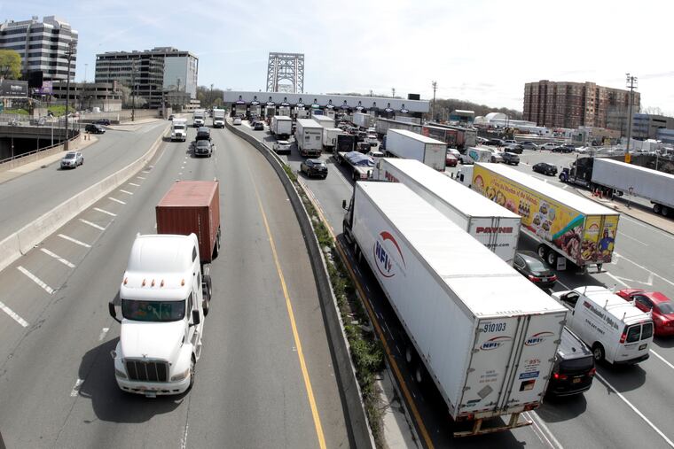 Vehicles, right, approaching the George Washington Bridge toll plaza in Fort Lee, N.J.