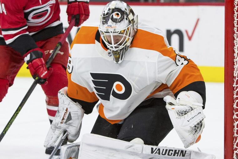 Flyers’ Goalie Alex Lyon watches a puck in front of the net during the second period of the Flyers’ 4-2 win on Saturday.