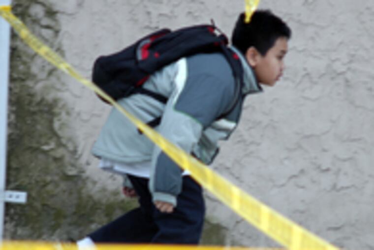 Police let boy scoot under crime tape to get home in South Philly. Abigail Vare Elementary had been locked down as a precaution.