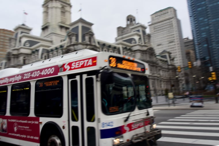 A SEPTA bus passes in front of City Hall, crossing 15th Street, heading along JFK Blvd. March 24, 2019.