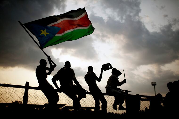 Southern Sudanese wave the national flag in the capital Juba in 2011.