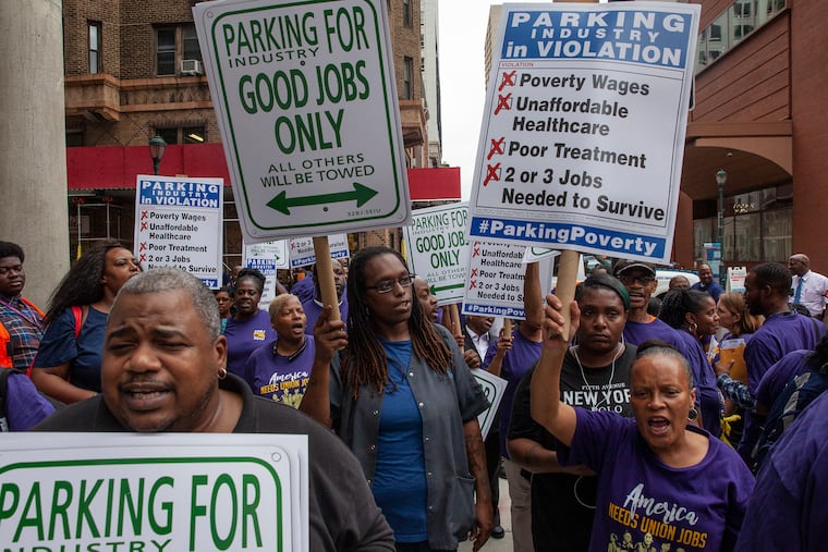 About 50 parking lot attendants and 32BJ SEIU members marched down 16th Street in Center City on Thursday afternoon to raise awareness for the parking lot workers' bid to unionize.