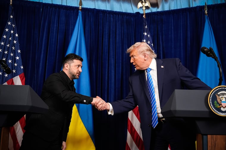 President Donald Trump and Ukraine's President Volodymyr Zelenskyy shake hands at the start of a joint news conference following a meeting at Trump's Mar-a-Lago club on Sunday in Palm Beach, Fla.