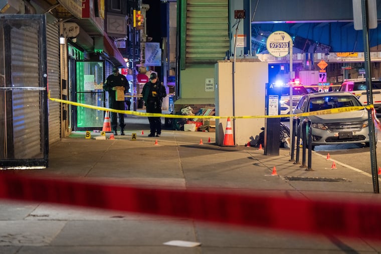 Police investigate the killing of Imani Ringgold, near 60th and Market Streets on Tuesday.