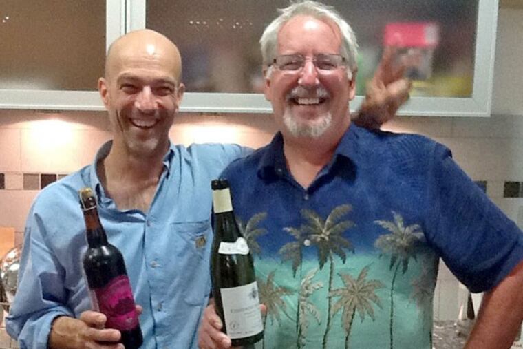 French wine expert Pascal Wagner (holding a bottle of Sly Fox Black Raspberry Reserve) with Don "Joe Sixpack" Russell (holding a bottle of Montrachet).