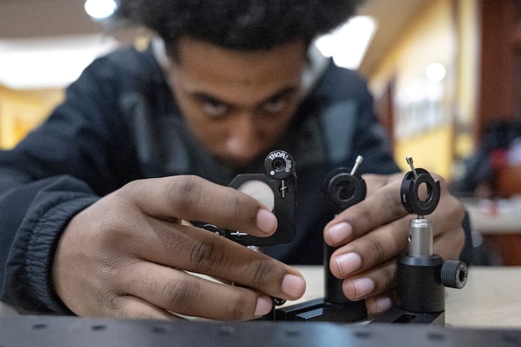 Central High School Junior Mohamed Bashir, works on STEM project during at after school program led by West Chester professor Brandon Mitchell.