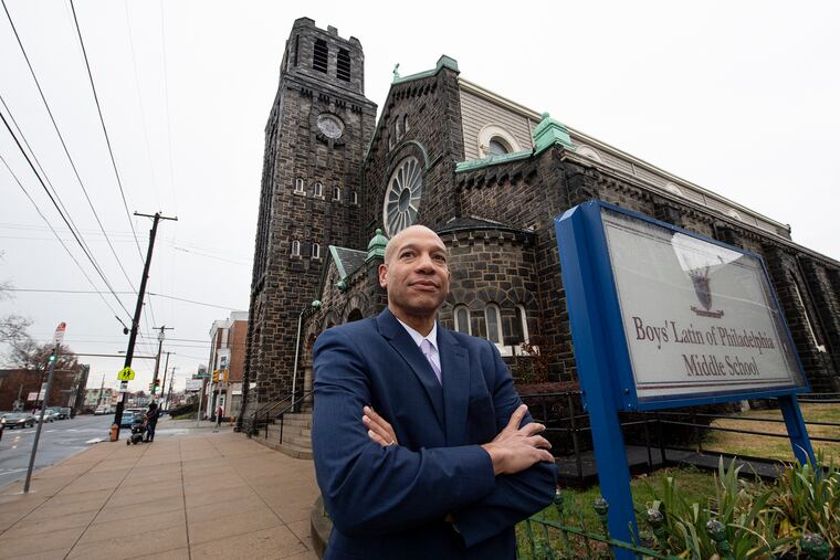 Noah Tennant, Boys' Latin CEO, stands in front of a vacant church building on the charter's middle school campus. The church is being considered for historic designation, which the charter says would make it a lot more expensive to renovate into a gym and performing arts space.