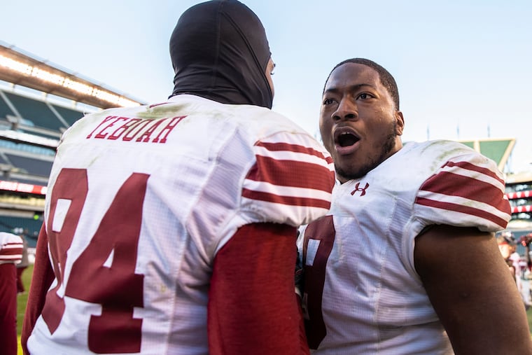 Temple tight end Kenny Yeboah (84) celebrates with Quincy Roche after the Owls defeated Tulane.