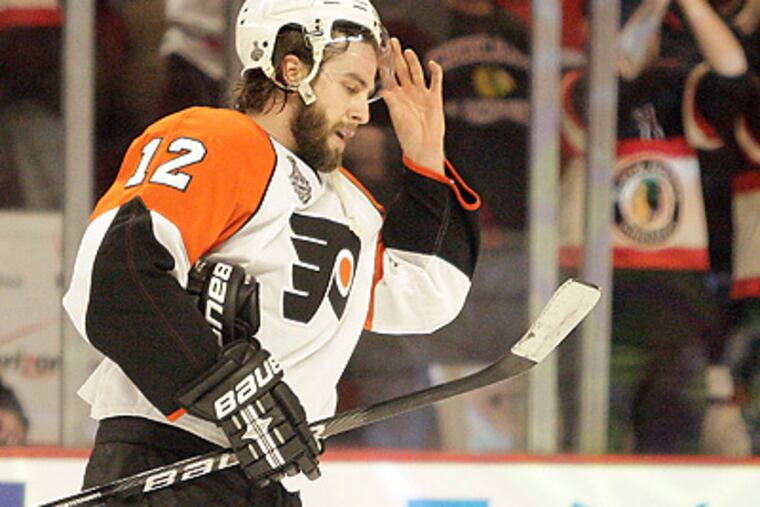 The Flyers' Simon Gagne skates off the ice after losing Game 2 of the Stanley Cup Finals. (Yong Kim / Staff Photographer)