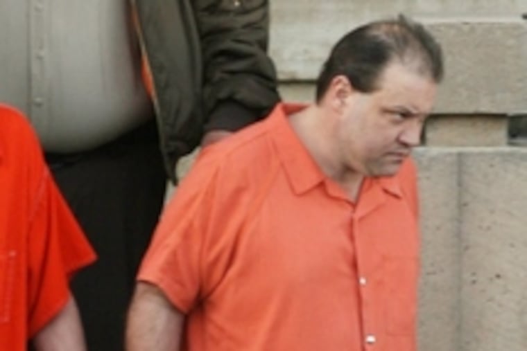 James "Bart" Huskey is led out of court yesterday.