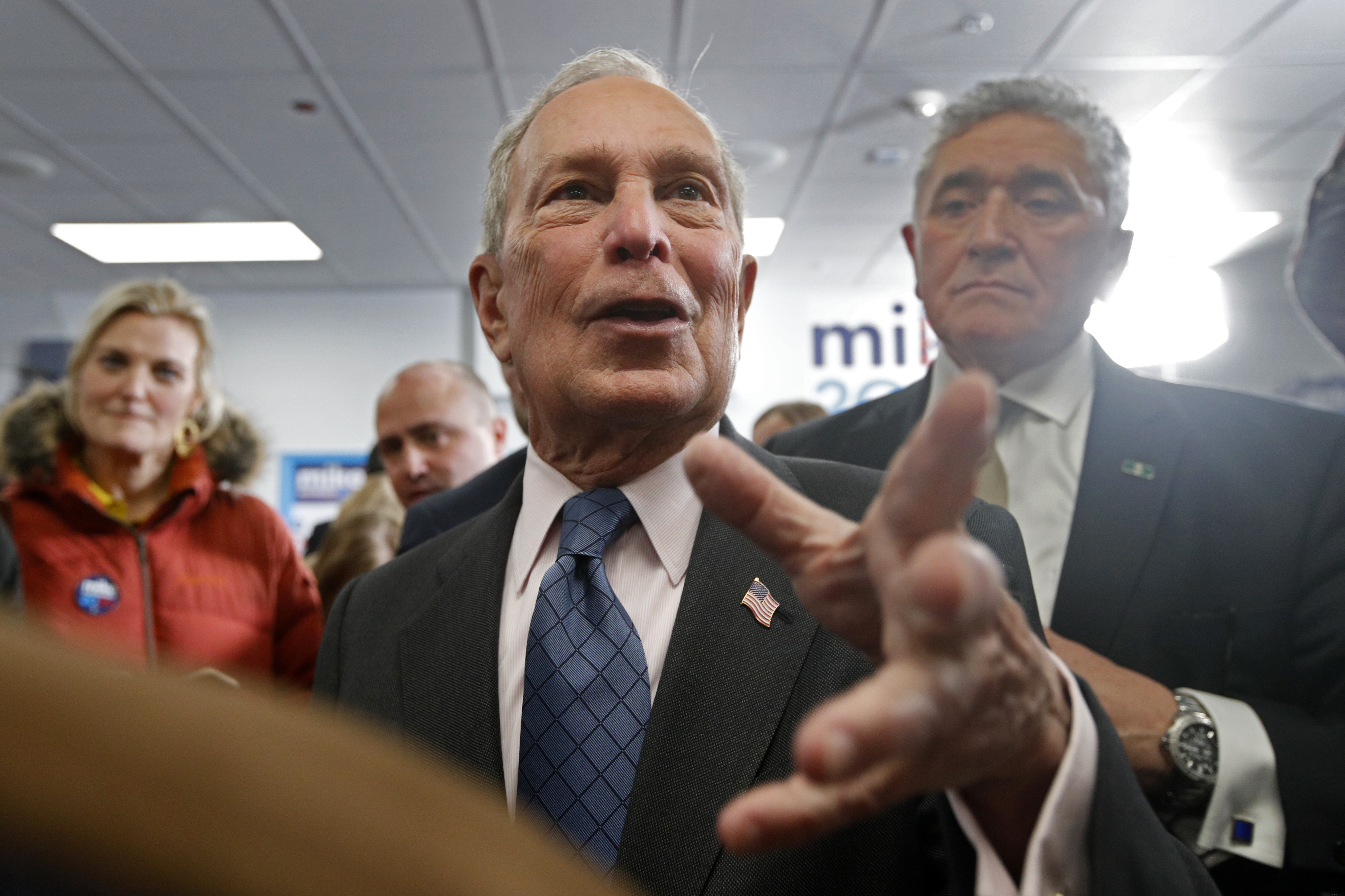 Democratic presidential candidate and former New York City Mayor Michael Bloomberg, center, greets supporters at a campaign office, Monday, Jan. 27, 2020, in Scarborough, Maine.