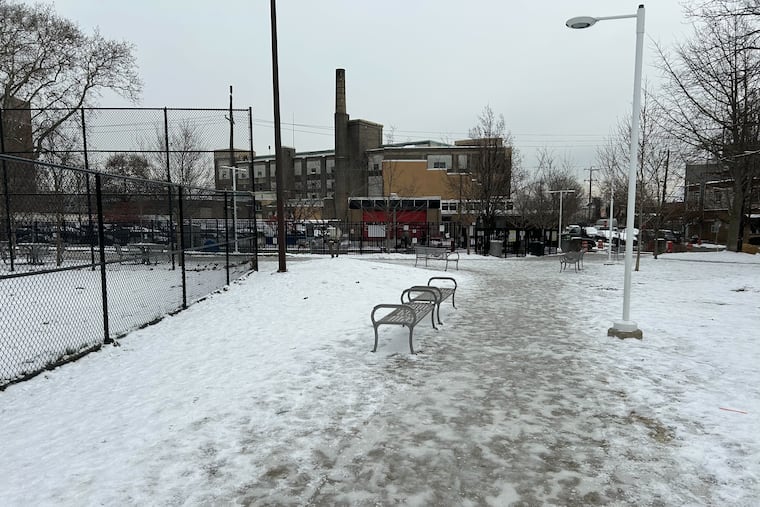 Icy walkways leading to a dog park and playground around Columbus Square Park at 13th and Wharton Streets in South Philadelphia on Thursday.