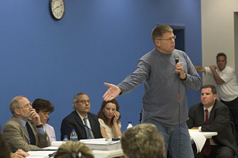 Parent George McClay, right, speaks out against the board of Philadelphia Academy Charter School at last night's meeting. (Ed Hille / Inquirer)