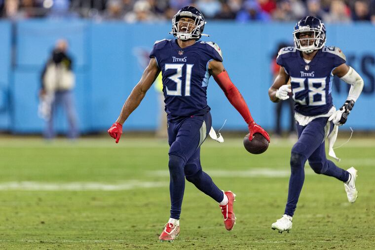 Tennessee Titans safety Kevin Byard celebrates with safety Joshua Kalu (28) after intercepting a pass against the Dallas Cowboys on Dec. 30, 2022.