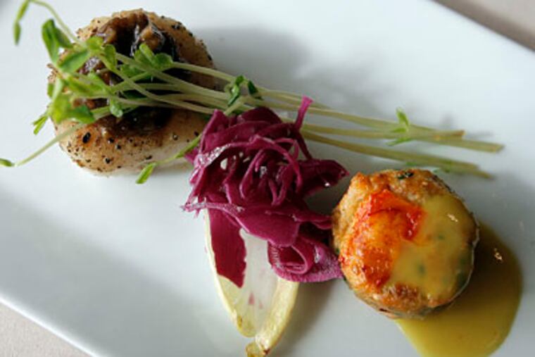 A pan-seared lobster cake and day-boat scallop from the Chinese New Year's banquet. (AKIRA SUWA / Staff Photographer)