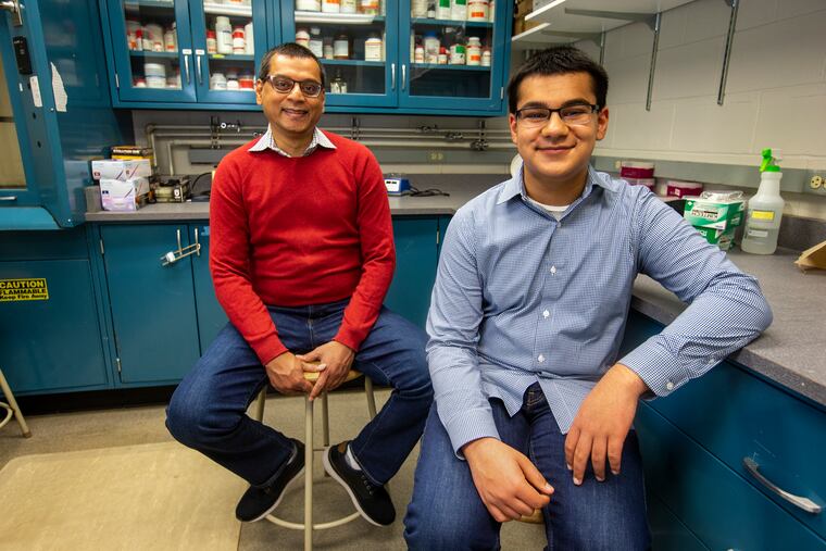 Vishal Shah and his 13-year-old son, Anand, conducted a study on whether COVID-19 can be found on grocery produce. They are pictured in a lab at West Chester University on March 26.