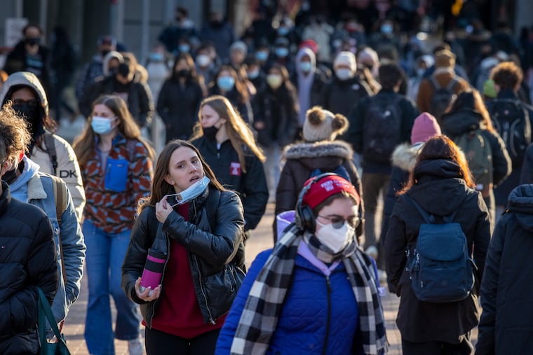 Students walk along Temple University's Polett Walk Monday morning. Students returned to class in-person this week after a delay due to the surge in COVID-19.