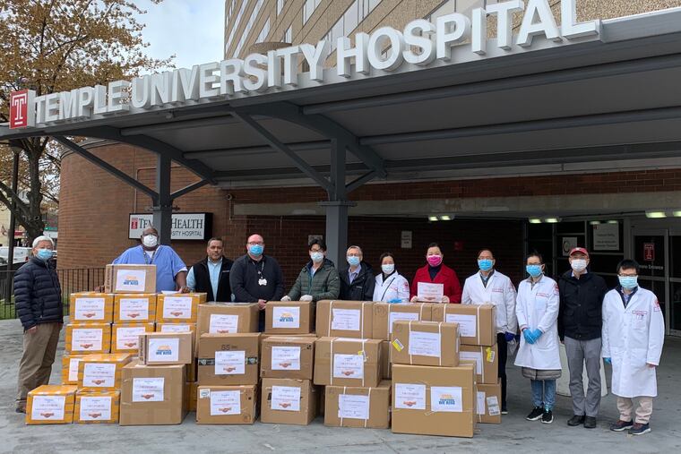 In January a group of Chinese American pharma professionals in the Philly area sent cash and protective gear to colleagues in Wuhan. Now their Chinese friends are returning the favor From left: Yi Zhang (Temple University Lewis Katz School of Medicine), Maurice Hightower, Johnny Marrero, Angelo Venditti, opthalmalogist Yi Zhang (all of Temple University Hospital), cardiologist Hong Wang (director, Temple Center for Metabolic Disease Research, Holly Meng (Temple University), and Katz school scientists Wenhui Hu, pathologist Jian Huang, Pingping Yang and Xianwei Wang.