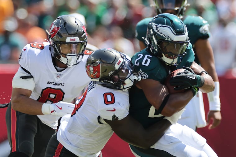 Tampa Bay Buccaneers linebacker Yaya Diaby tackles Eagles running back Saquon Barkley during last year's matchup.
