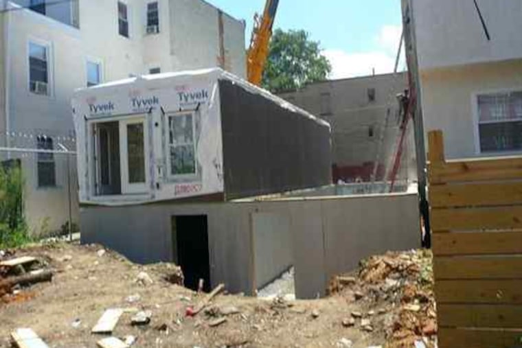 "You can't tell them" from traditional Philadelphia rowhouses, Nick Pizzola says of his company's modular homes. "You can assemble them in 24 hours."