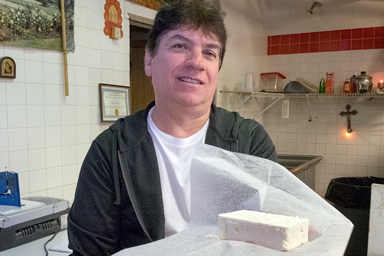 Vladimir Hajdari, owner of N&E Agora in Northeast Philadelphia, with feta. Finding good feta in the U.S. has become something of an Olympic sport.