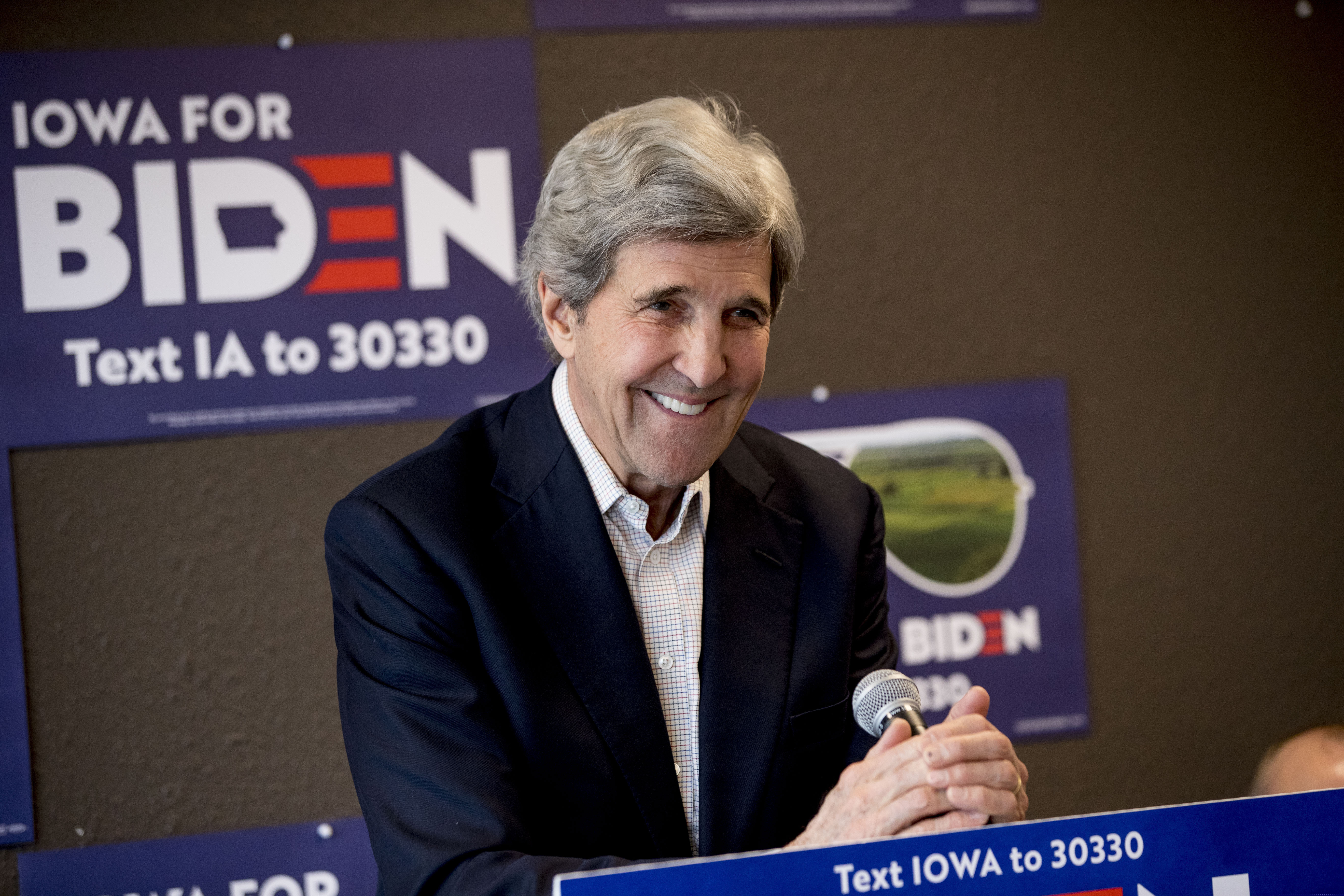 In this Jan. 9 photo, former Secretary of State John Kerry smiles while speaking at a campaign stop in Fort Dodge, Iowa, to support Joe Biden.