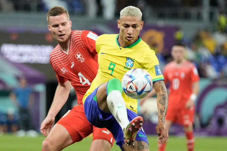 Brazil's Richarlison (right) playing against Switzerland.
