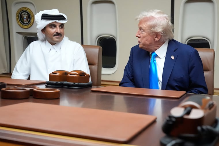 President Donald Trump meets with Emir of Qatar Sheikh Tamim bin Hamad al-Thani aboard Air Force One at Al Udeid Air Base in Doha, Qatar, on Oct. 25, 2025.