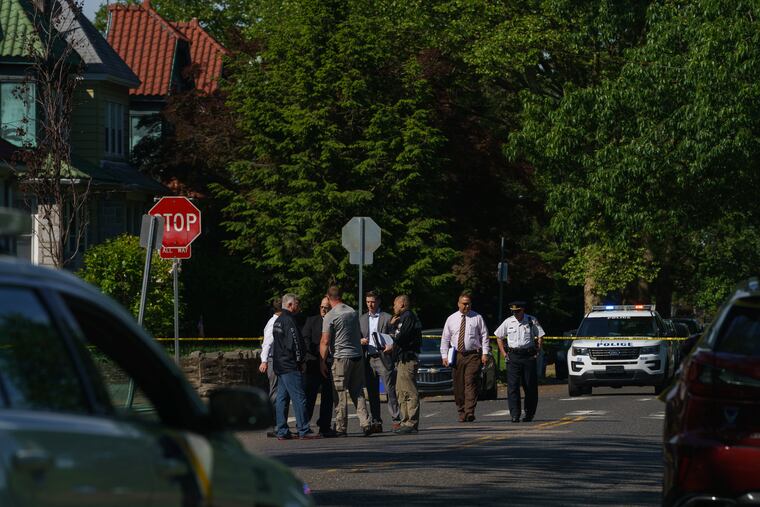 Investigators on the 5900 block of Charles Street in Wissinoming after U.S. Marshals shot and wounded a man who police said was armed with a machete.