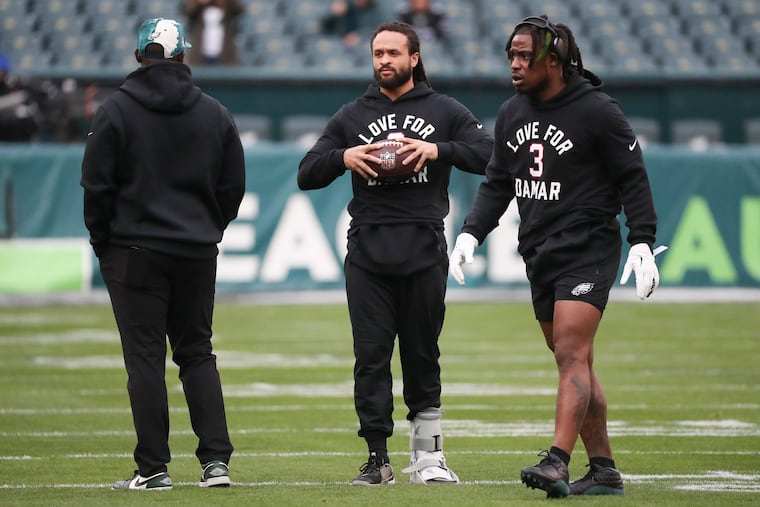 Injured Eagles cornerback Avonte Maddox (center) with safety C.J. Gardner-Johnson before the win against the New York Giants at Lincoln Financial Field.