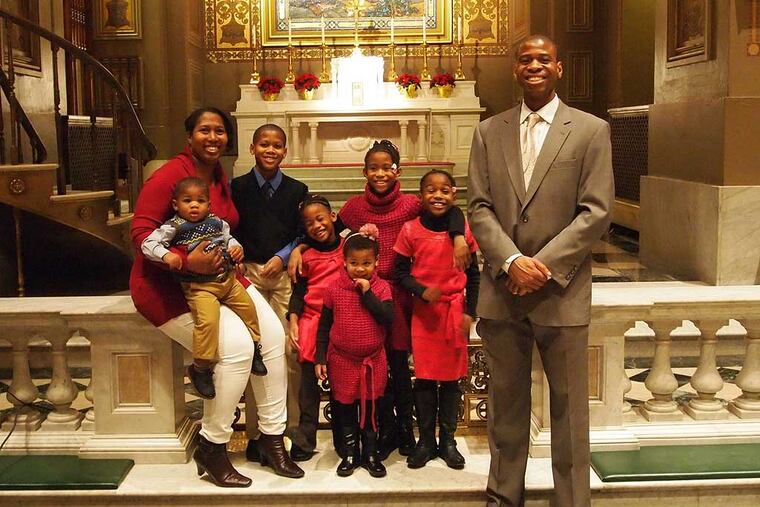 Image002: Philip Clark, his wife Shakirra, and their six children at church.
A collection of essays by four local black men on their perspectives post Ferguson. Provided by each essayist