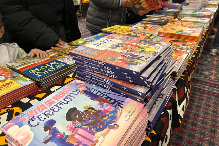 People browse the tables of books at the Pennsylvania Convention Center for the 32nd annual African American Children's Book Fair on Saturday.